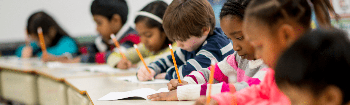A diverse classroom of young students taking an IQ test