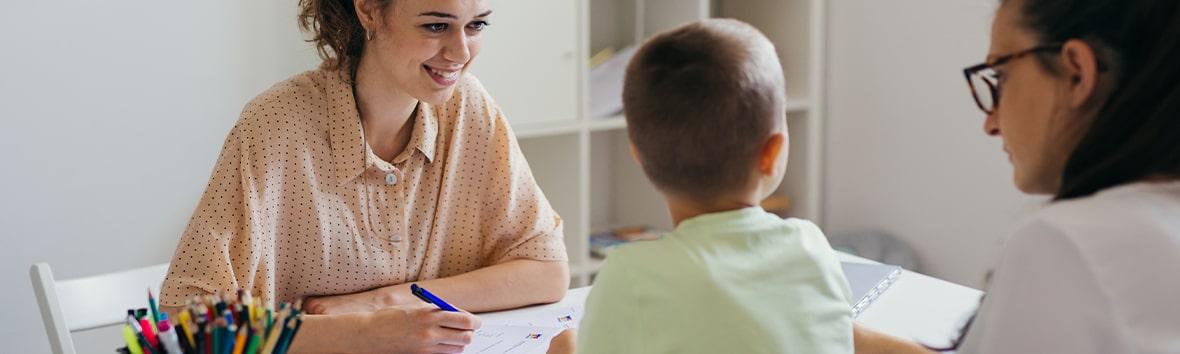 Parent speaking to a clinician about autism assessment options