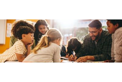 Teacher is demonstrating how to complete an assignment to his students
