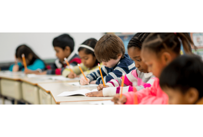 A diverse classroom of young students taking an IQ test