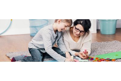 Clinician evaluating a child for symptoms of autism