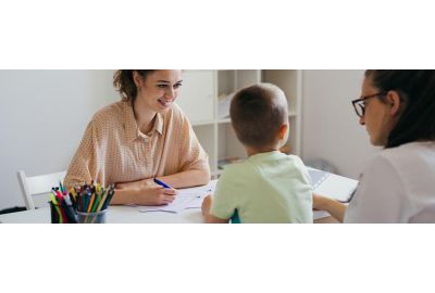Parent speaking to a clinician about autism assessment options