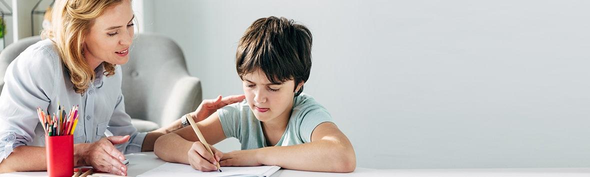 A practitioner assessing a child for dyslexia.