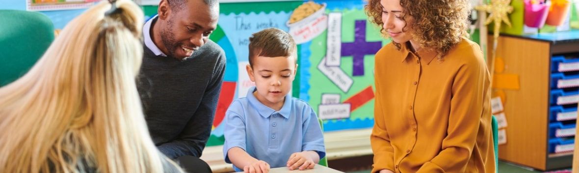 Helping Families Navigate Early Intervention - parents and teacher discussing concerns and next steps with their child