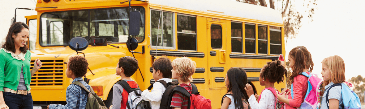 Elementary school students lining up for the bus