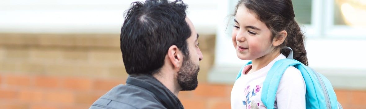 A Holistic Approach to Back-to-School Season - A father dropping his daughter off at preschool