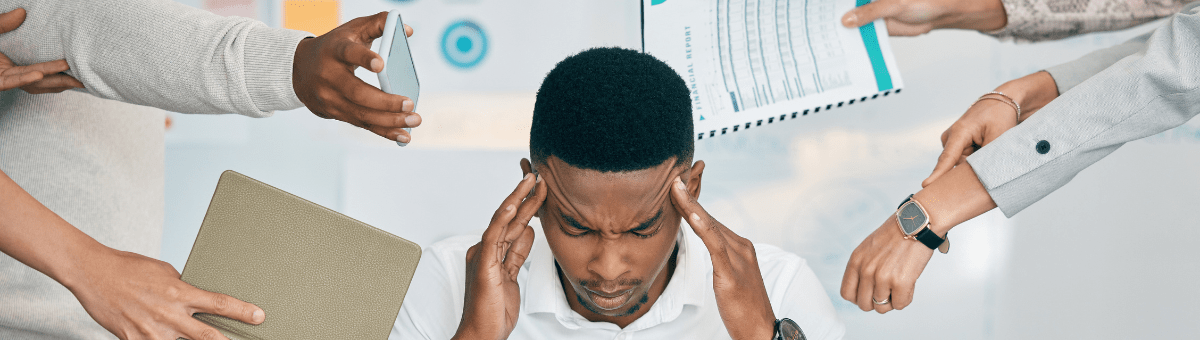 What Anxiety Can Feel Like - A depiction of a man feeling overwhelmed with responsibilities and tasks at work